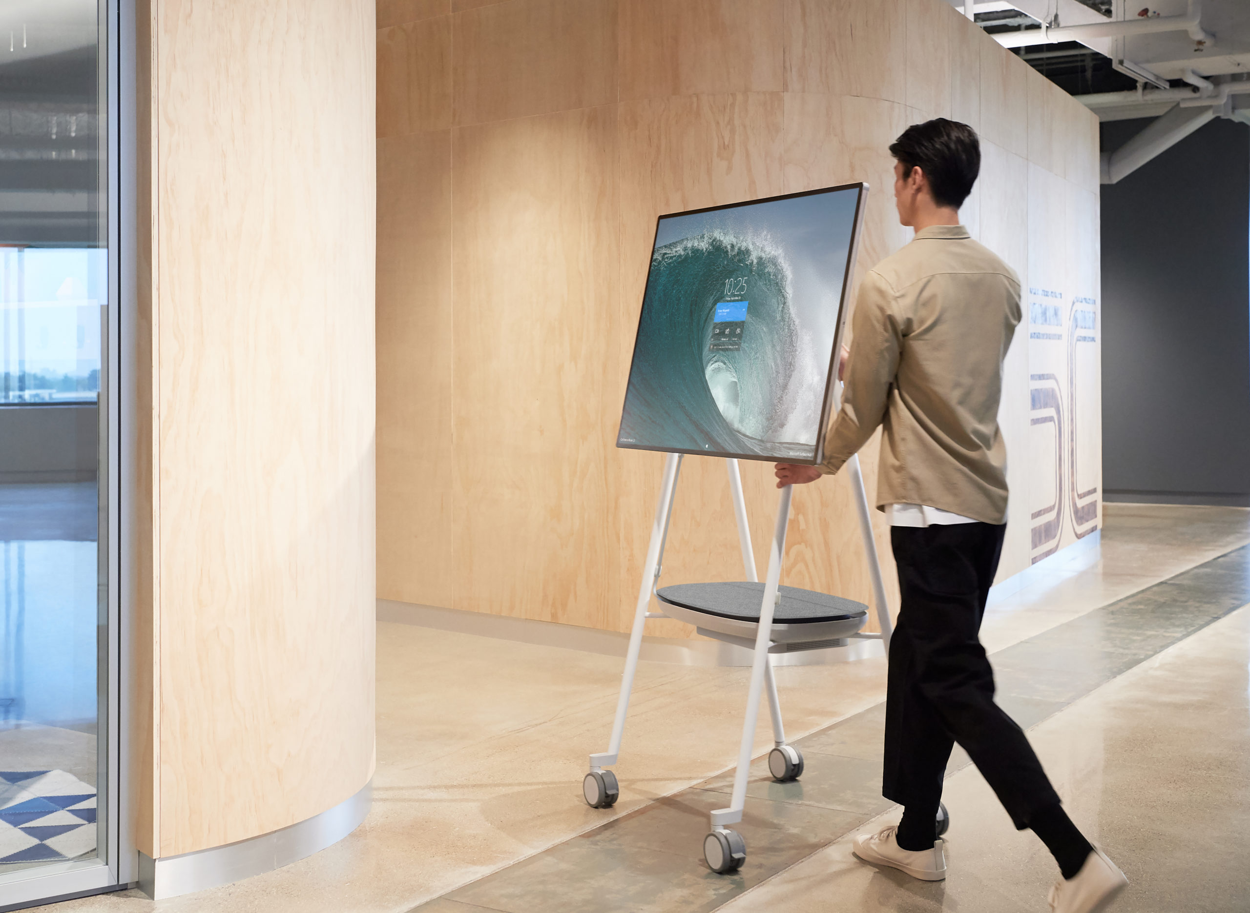 A person moving surface Hub 2S in his workplace.