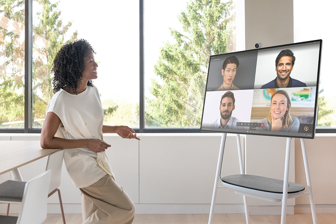 A woman attending Microsoft Teams call using Surface HUb 2S