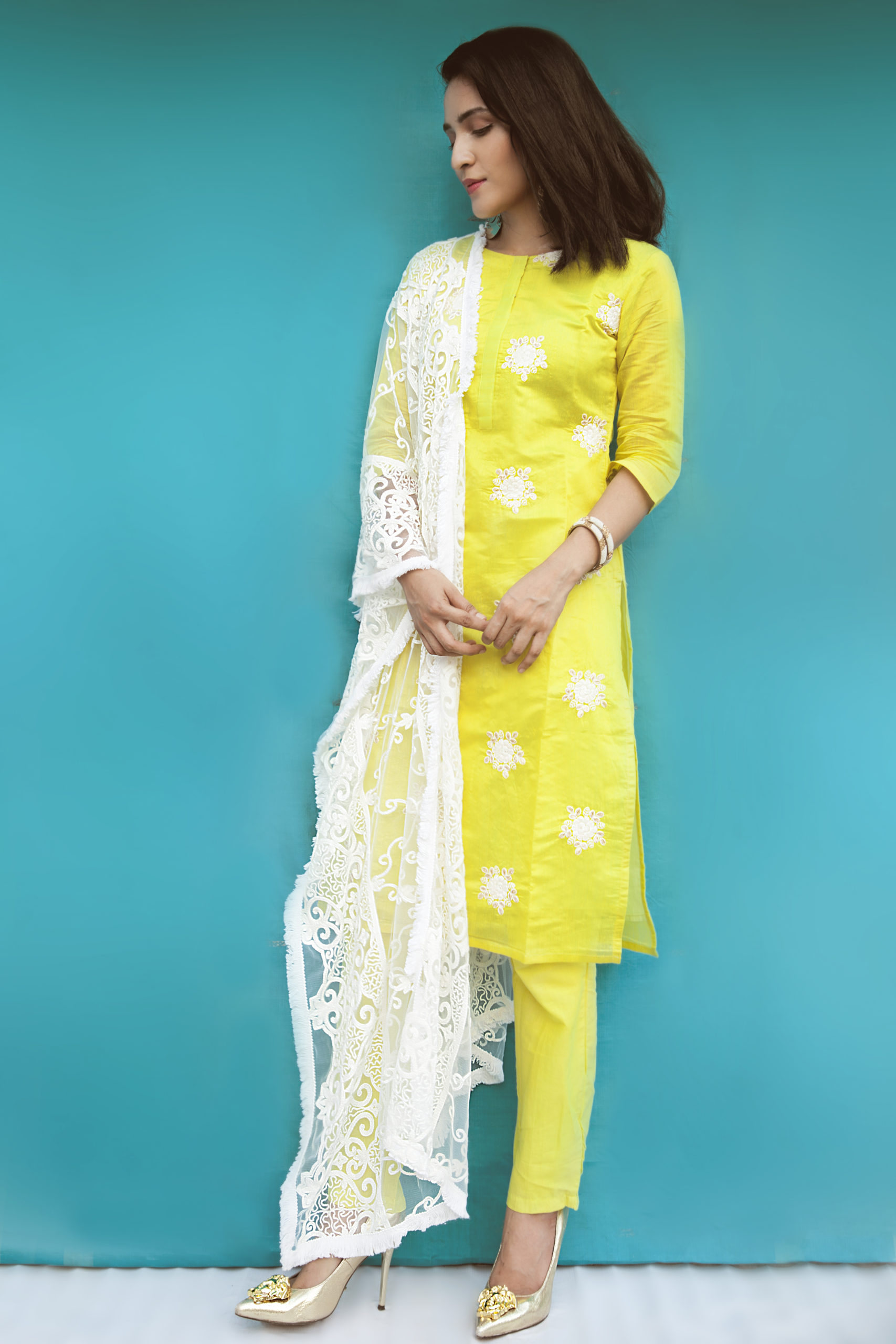 A woman wearing Indian ethnic attire posing for the camera