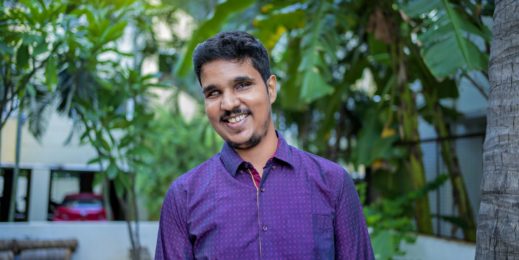 Photo of a man smiling at the camera