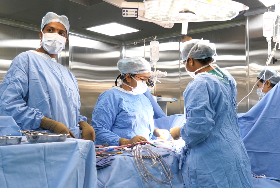 A photo of doctors standing around an operating table