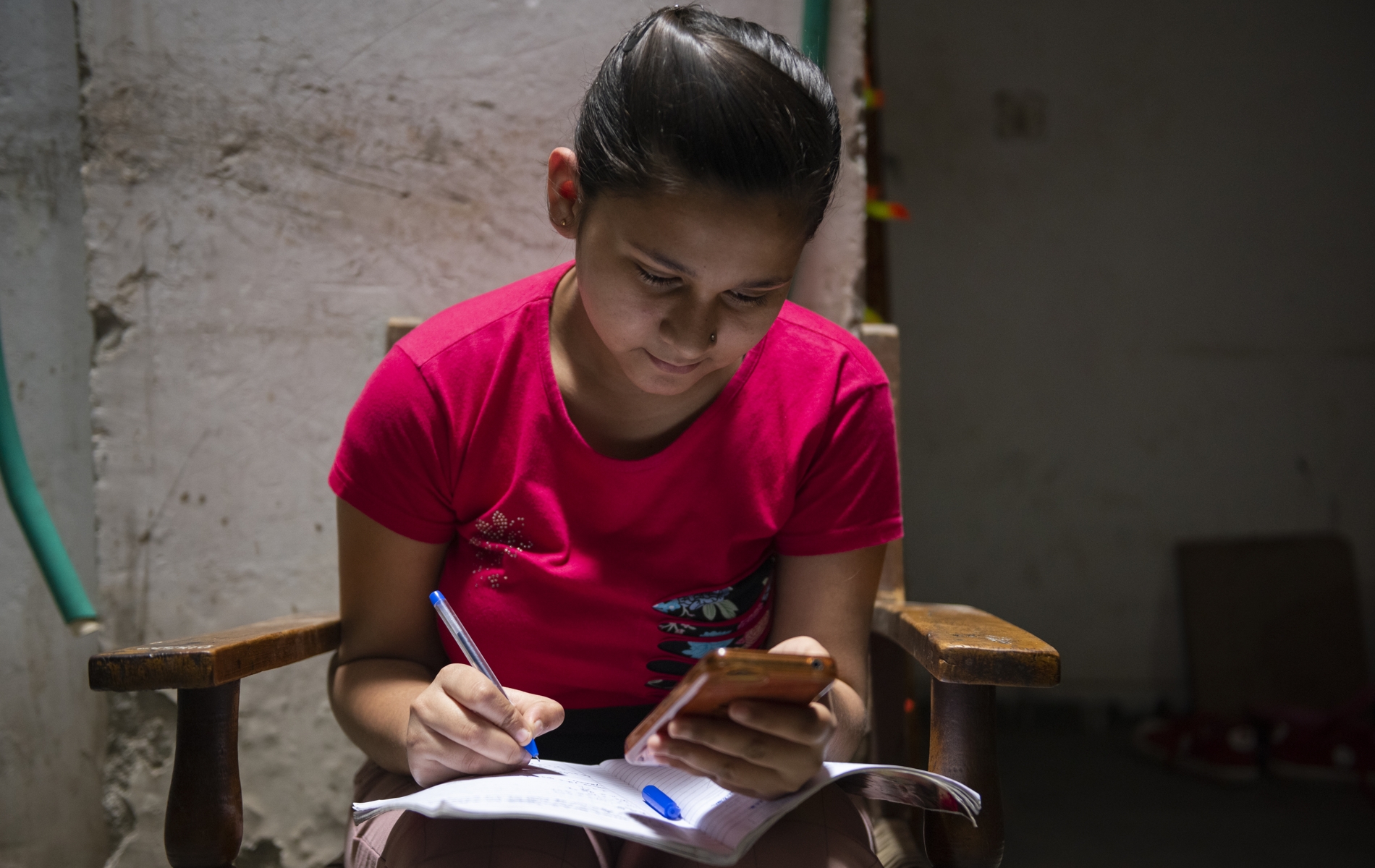 Photo of a girl studying via online classes at her home