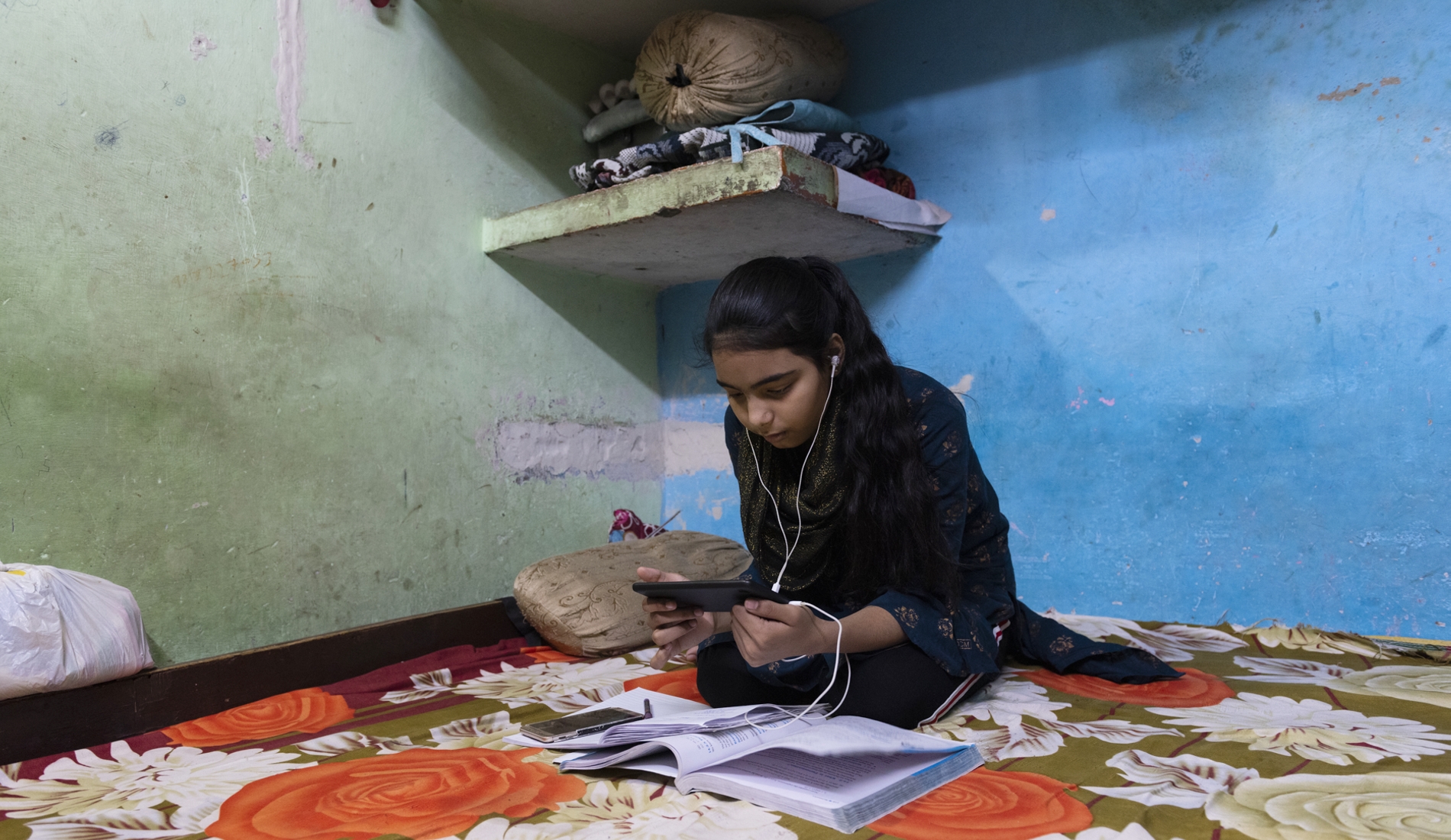 Photo of a girl studying via online classes at her home