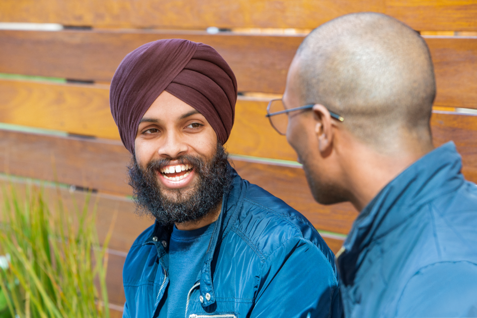 Two men talking to each other