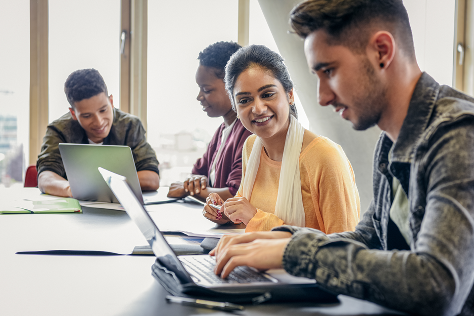 Young people working on a laptop