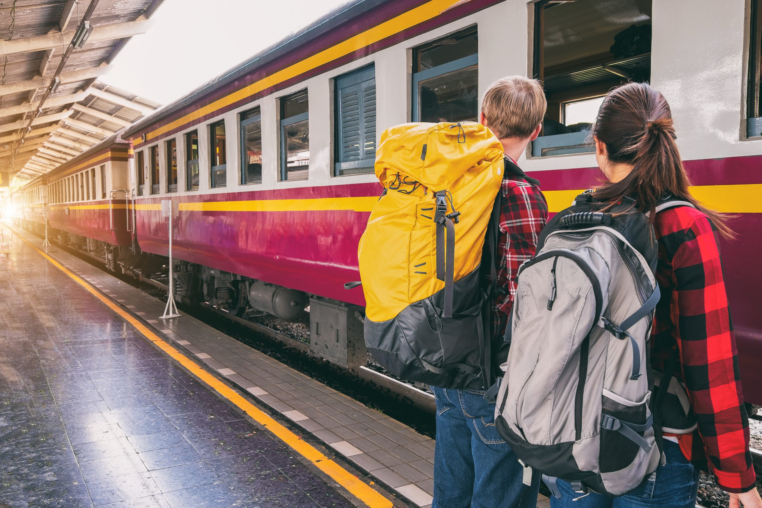 two people waiting for train