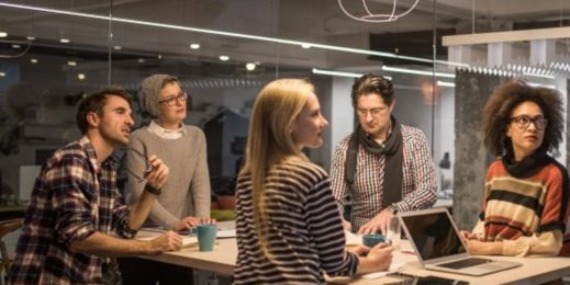 Photo of six people in a meeting room