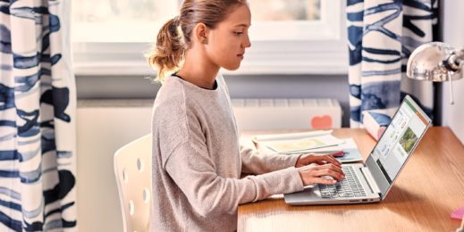 a girl with a laptop at home