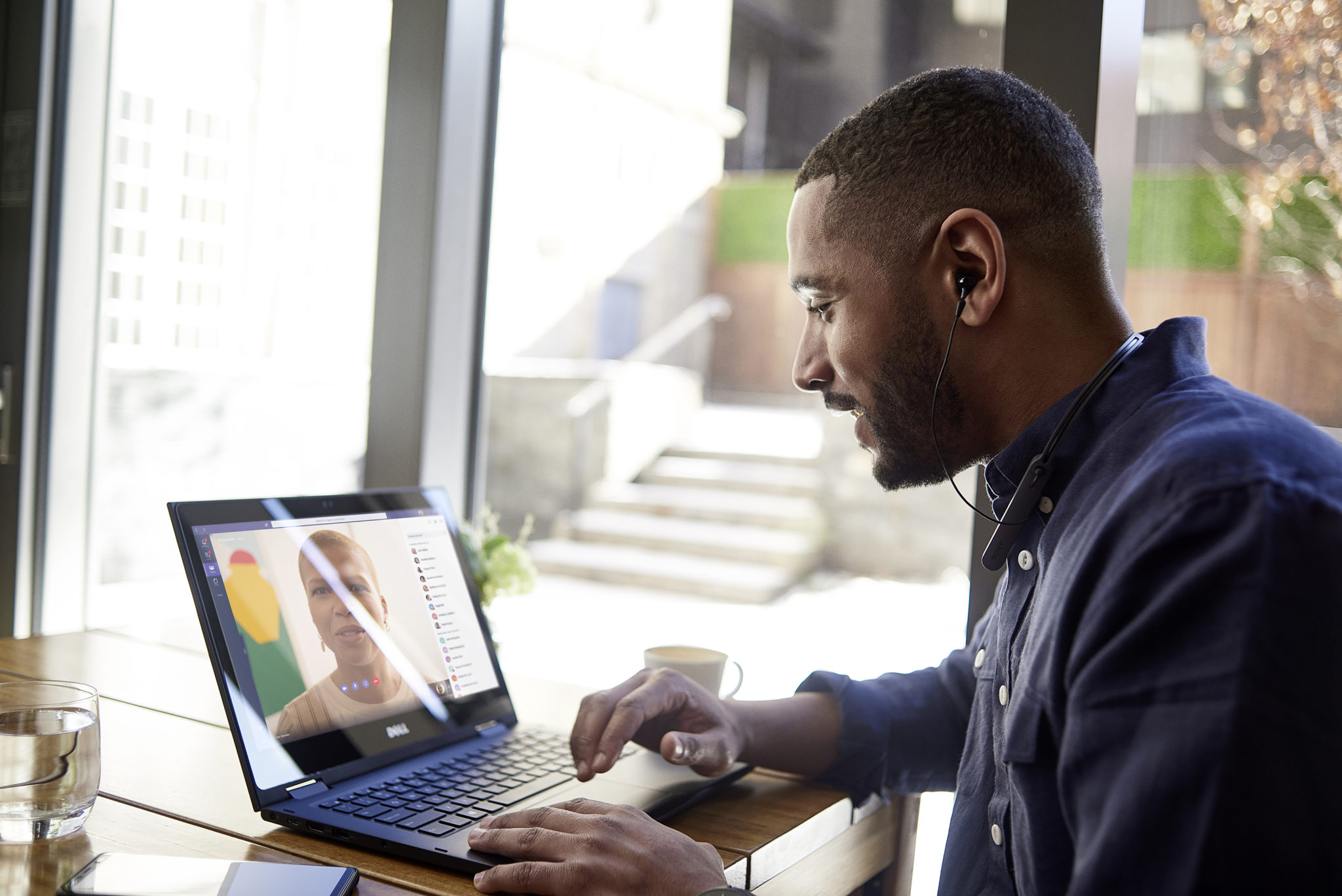 Man meets with another person using Microsoft Teams on his laptop