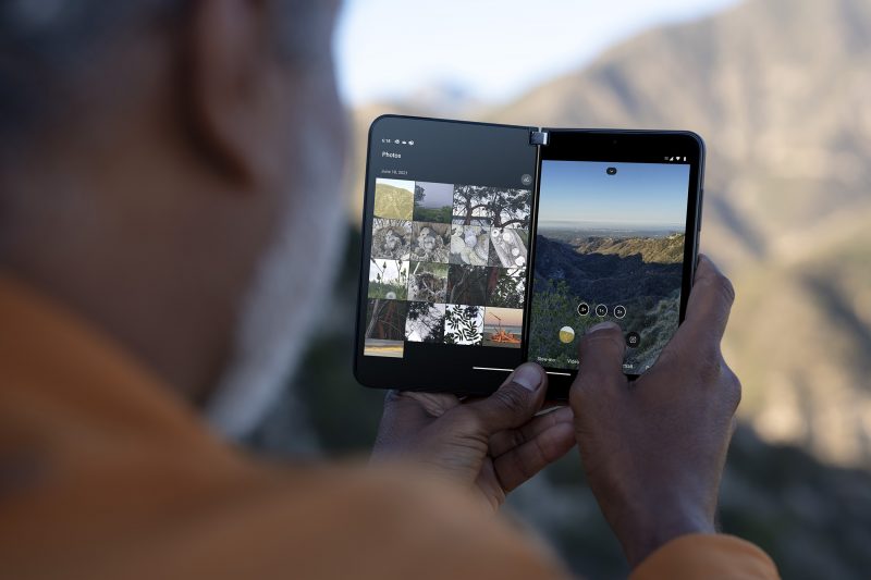 A man using his Surface Duo 2 phone