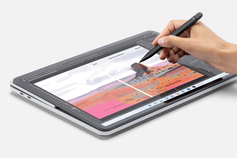 A person using a Surface pen on a Surface laptop