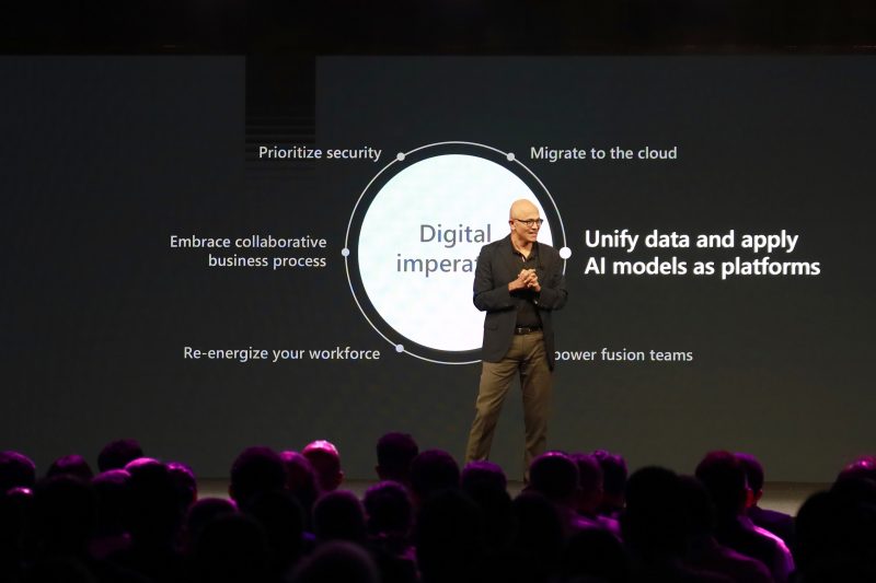 satya nadella presenting on stage