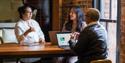 Image of colleagues taking a meeting