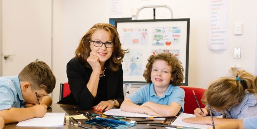 Charity worker with young students