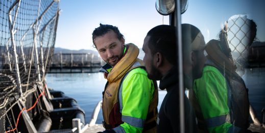 Salmon farmer on a boat