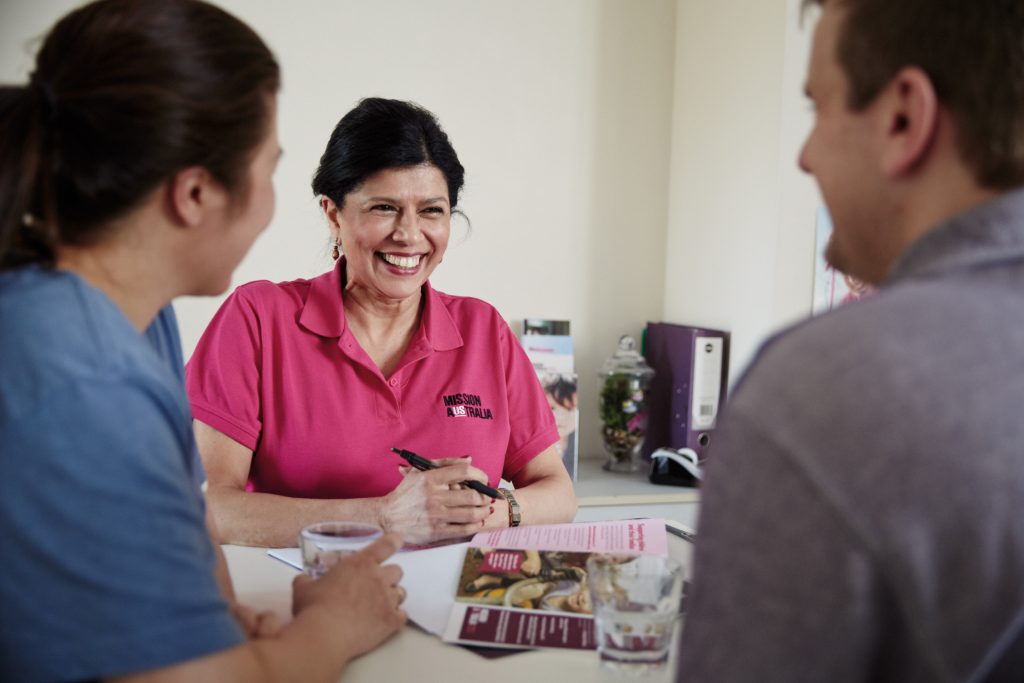 Mission Australia workers with client