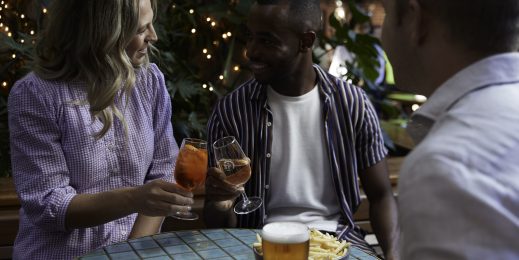 Diners enjoying a drink at their table