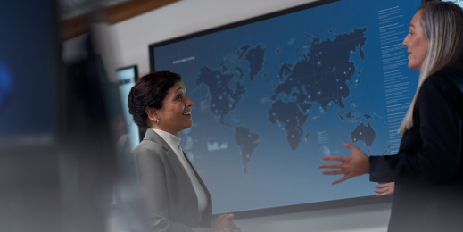 CISO (chief information security officer) collaborating with a practitioner in a security operations center