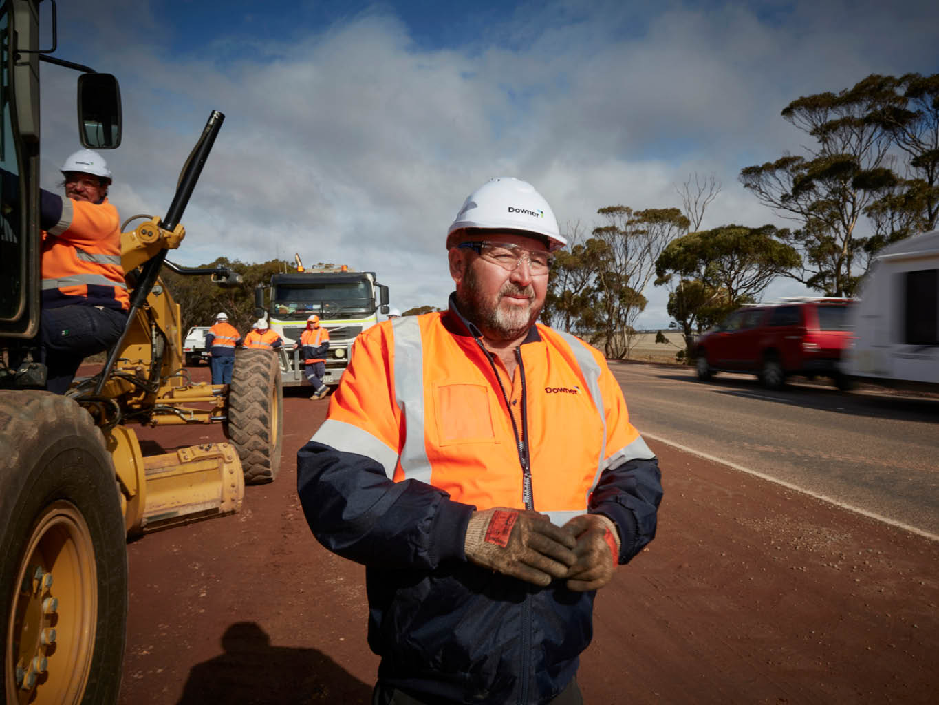 A male wearing a helmet and safety gear clothing