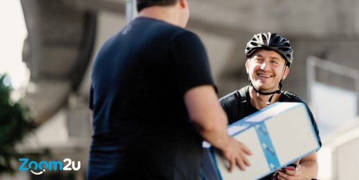 A delivery man giving a parcel to customer