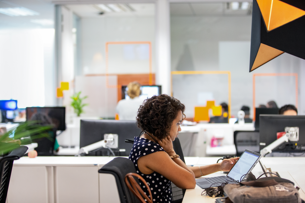 Female employee sitting at her desk