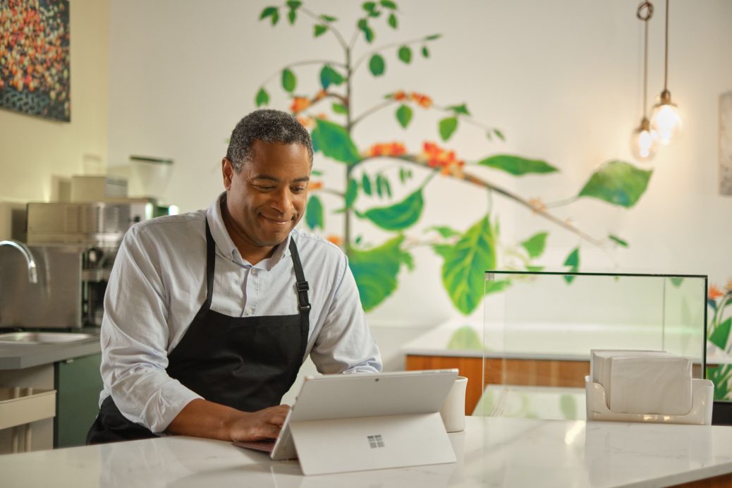 Restaurant owner keeping working at desk.