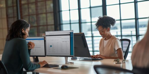 Enterprise office colleagues collaborating in an open workspace