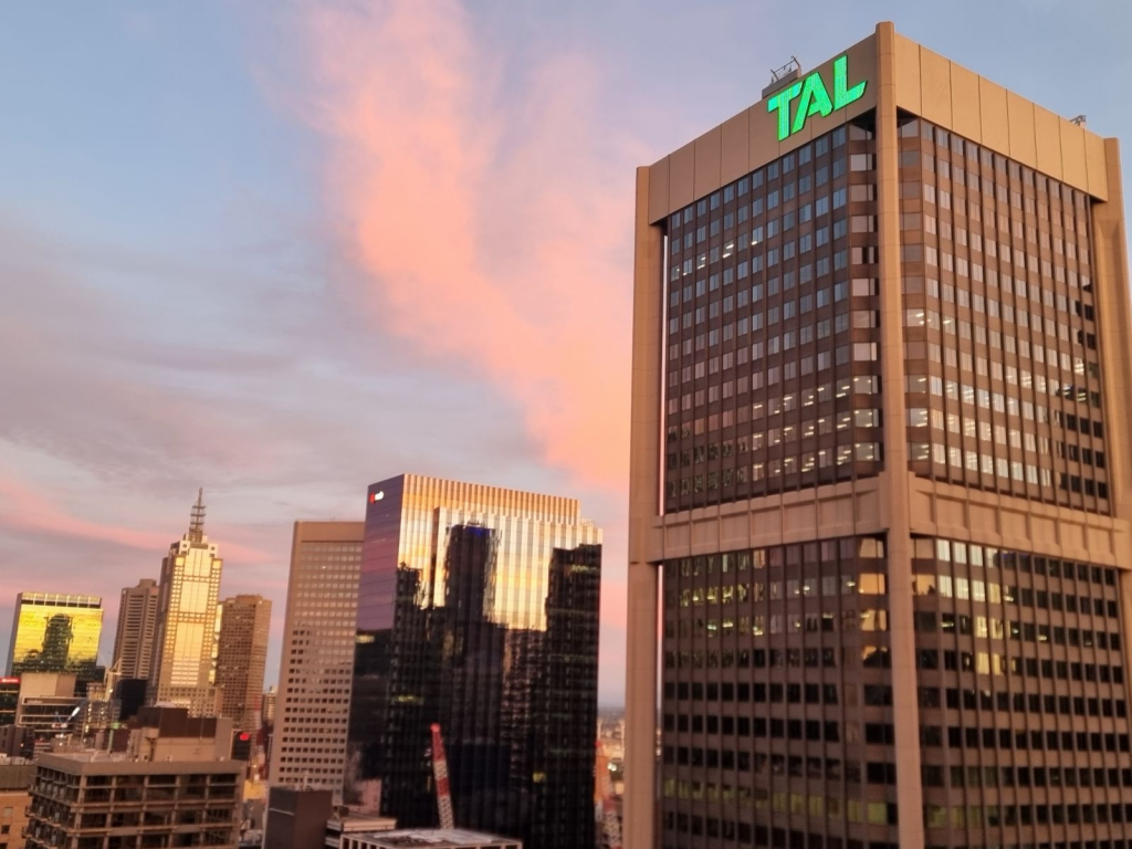 High rise building with TAL green logo