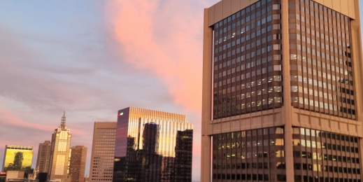 High rise building with TAL green logo