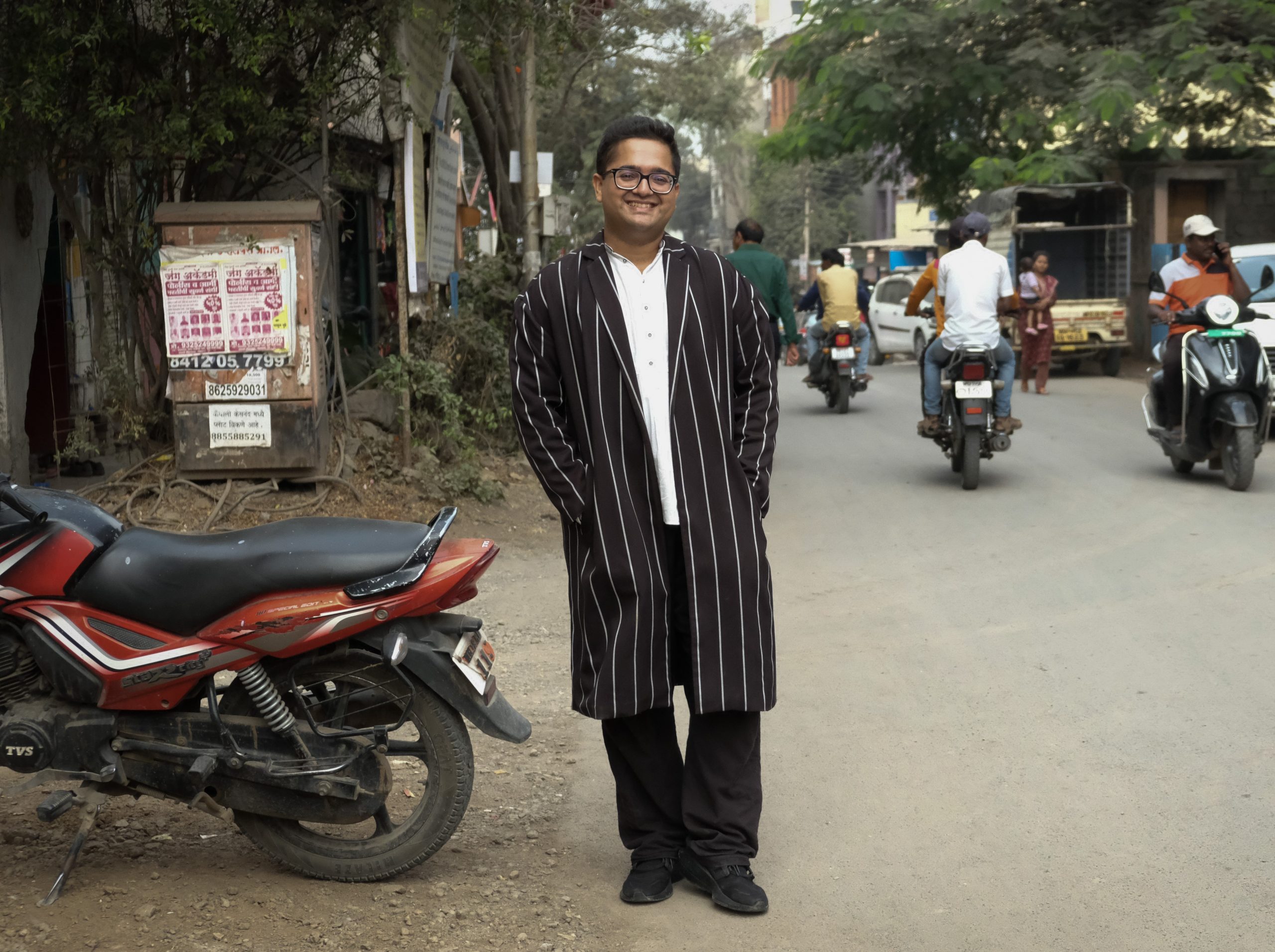 Outside portrait of a man standing in a busy street