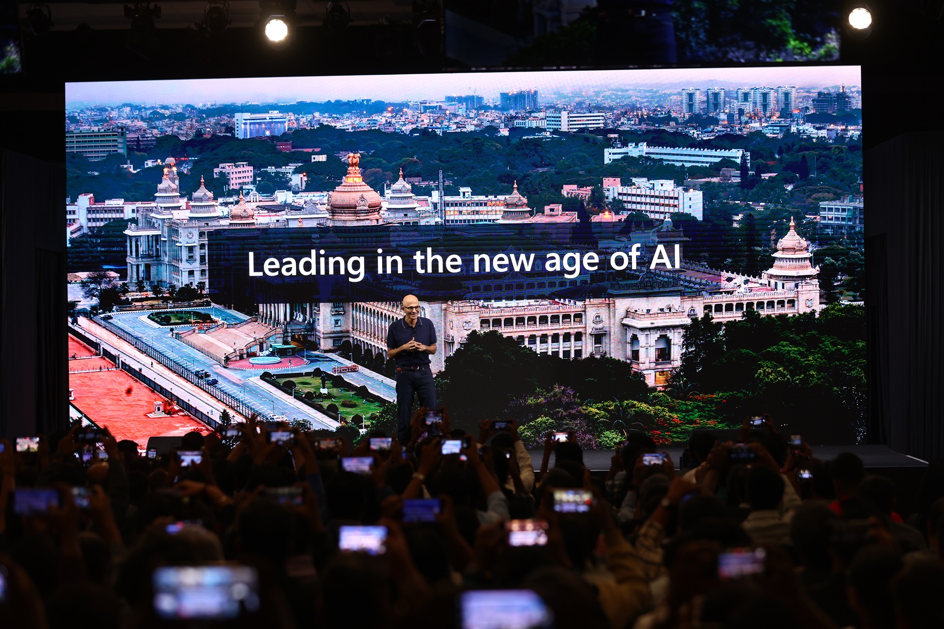 Microsoft chairman and CEO Satya Nadella giving a keynote address on stage