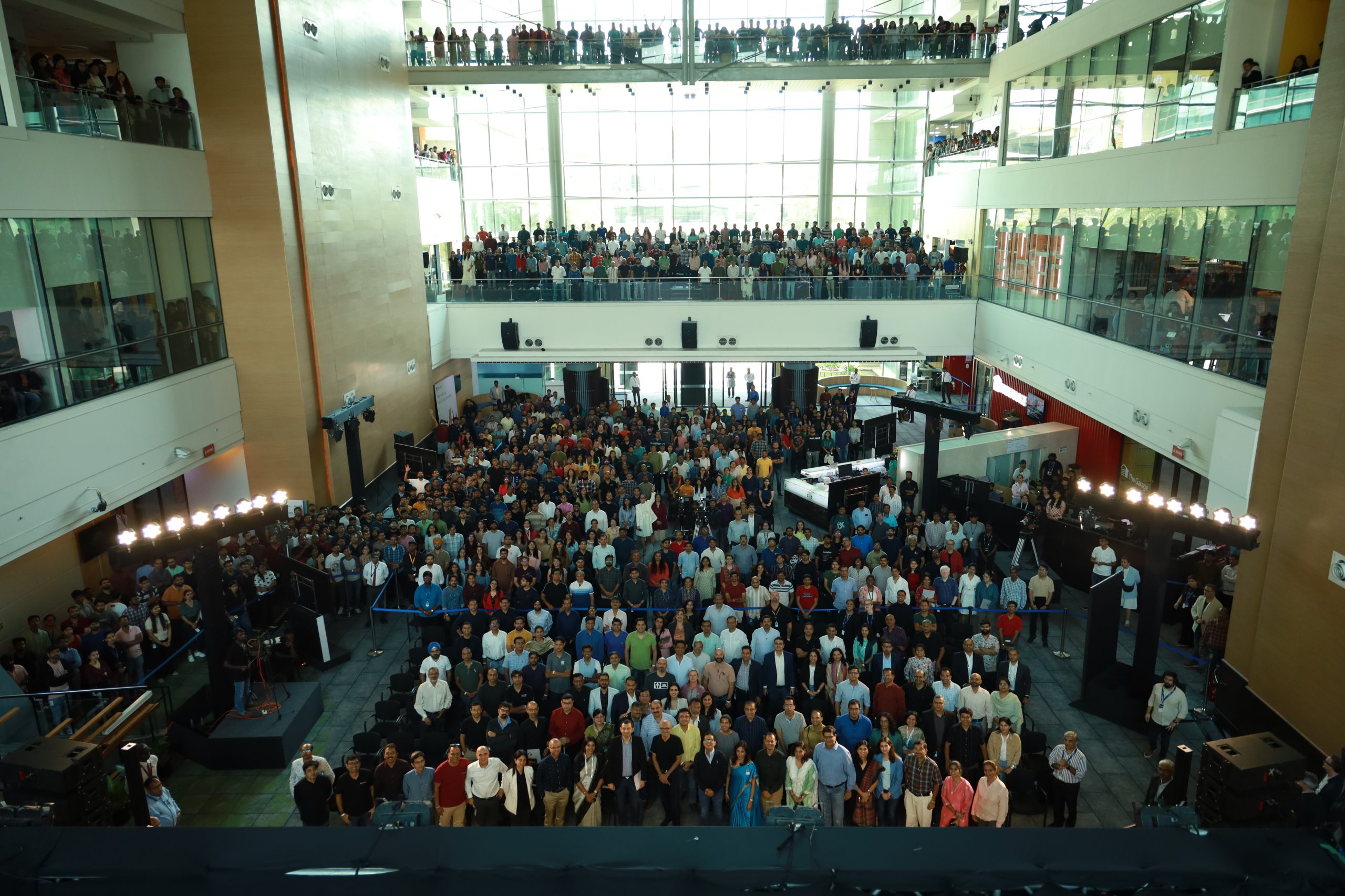 Aerial shot of employees gathered at an office townhall