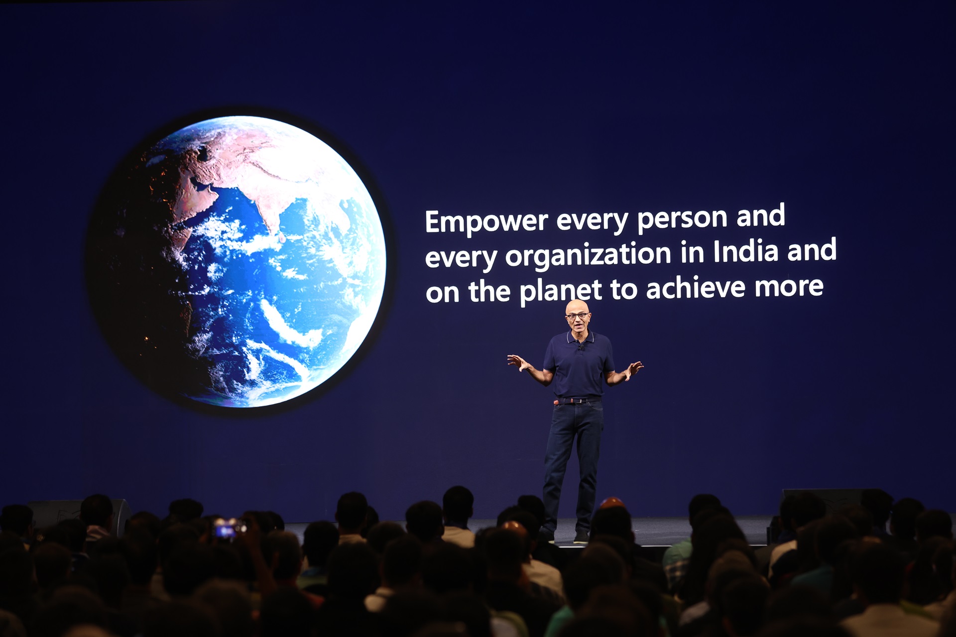 Microsoft chairman & CEO Satya Nadella giving a keynote address on stage